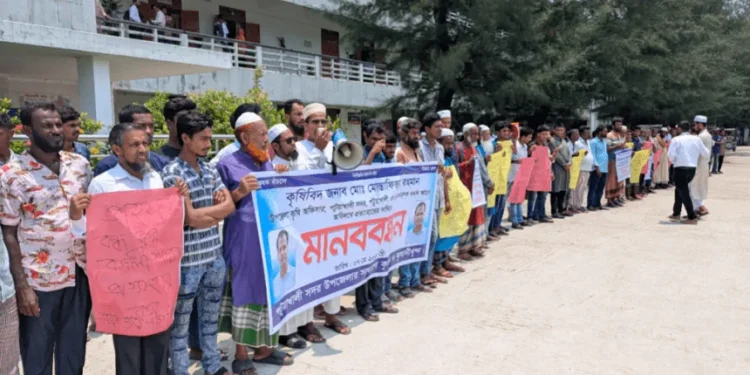 কৃষকদের কর্মকর্তাকে বদলির পাঁয়তারা, স্বপদে বহলের দাবিতে কৃষকদের মানববন্ধন।
